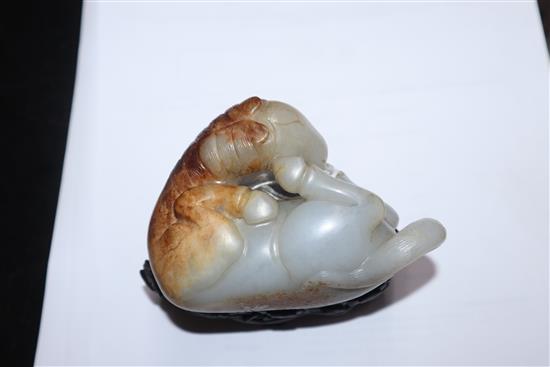 A Chinese pale celadon and russet jade horse, wood stand 9cm high including stand